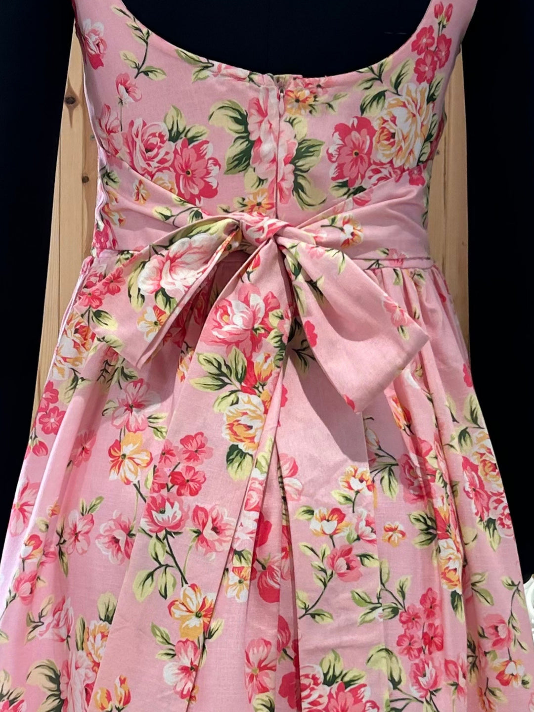 Pink Elegant Printed Midi Dress With Flowy Skirt And Back Bow Detail