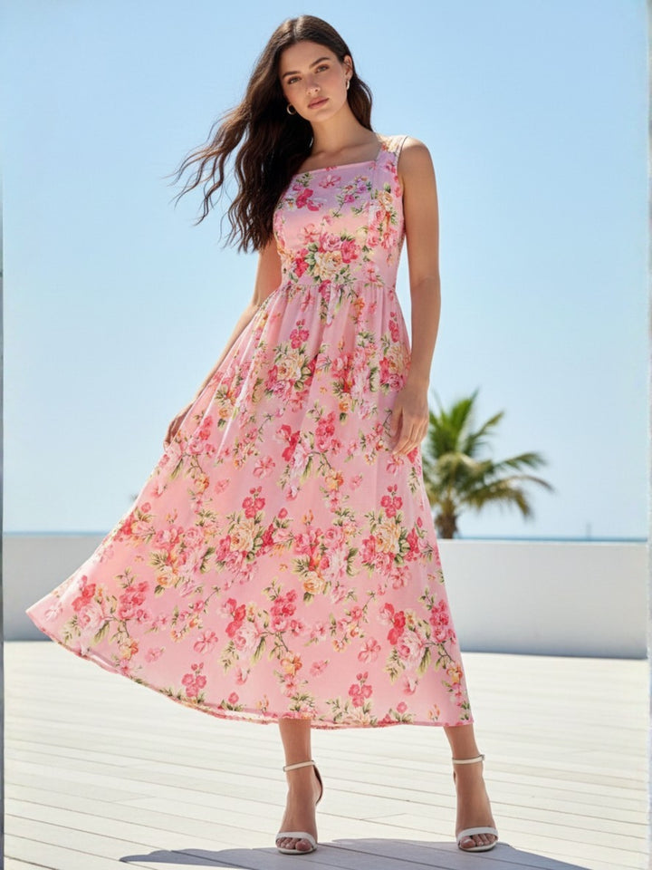 Pink Elegant Printed Midi Dress With Flowy Skirt And Back Bow Detail