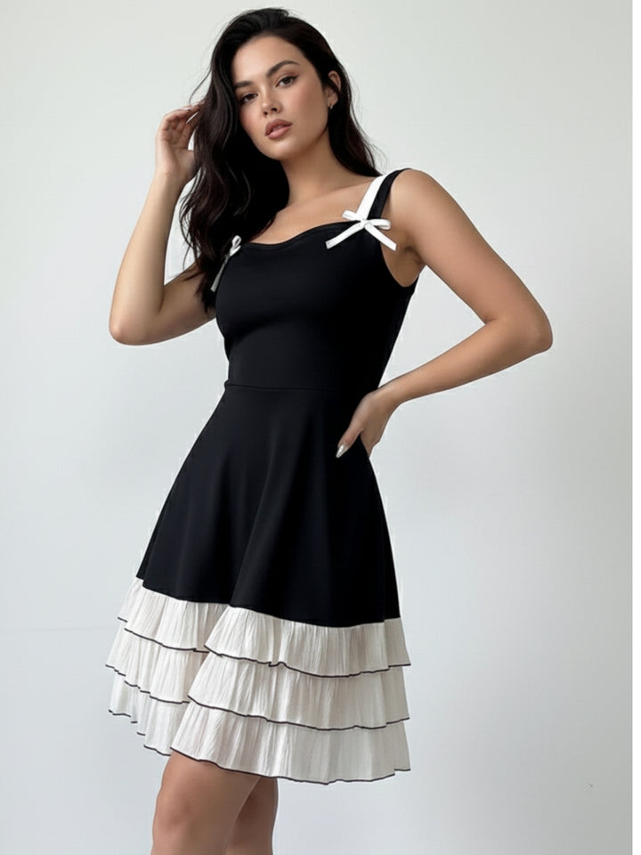 Black Mini Dress With Contrast Ruffled Hem And Bows On Straps