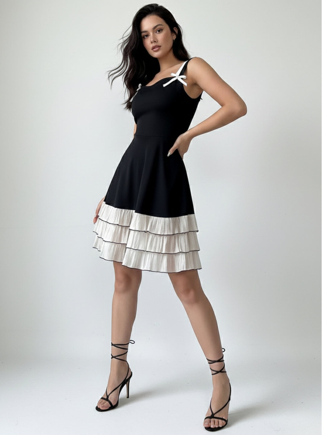 Black Mini Dress With Contrast Ruffled Hem And Bows On Straps