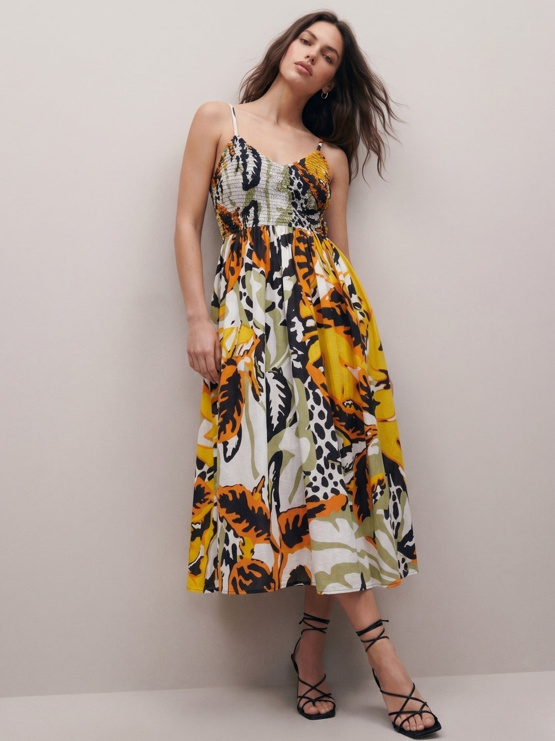 Multi Printed A-Line Silhouette With A Diamond Smocked Upper Bodice And Flowy Skirt
