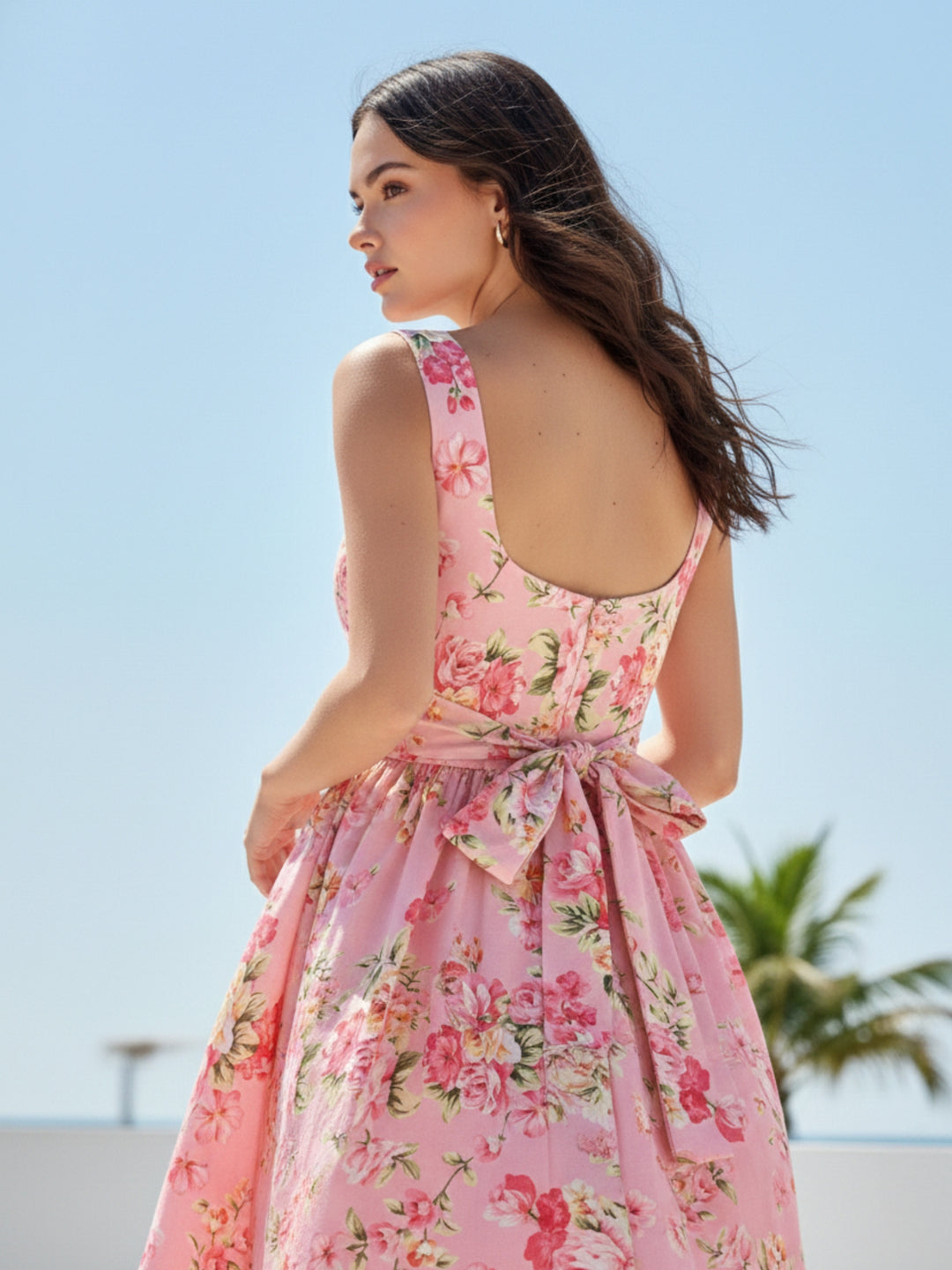 Pink Elegant Printed Midi Dress With Flowy Skirt And Back Bow Detail