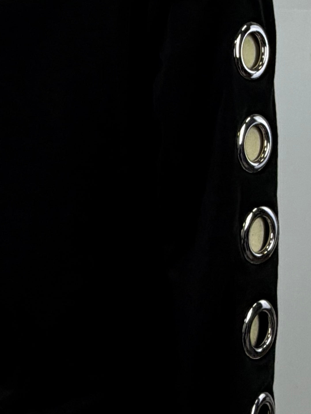 Black Sweatshirt With Metal Eyelets On The Sleeves